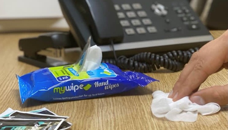 Antibacterial wipes being used in an office