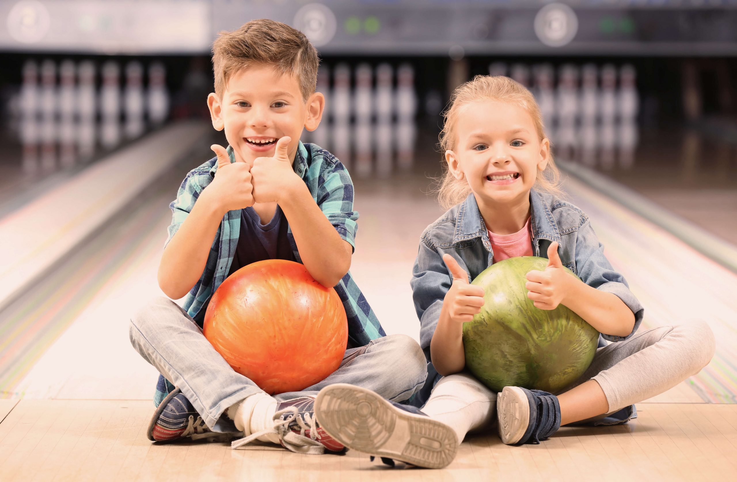Children at bowling alley reflecting how our role as private label wet wipe manufacturers can help reassert confidence into the leisure industry.